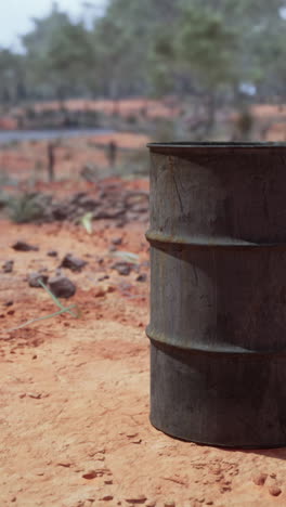 rusty barrel in a desert landscape