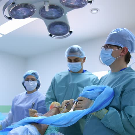 modern equipment in operating room. medical team performing operation