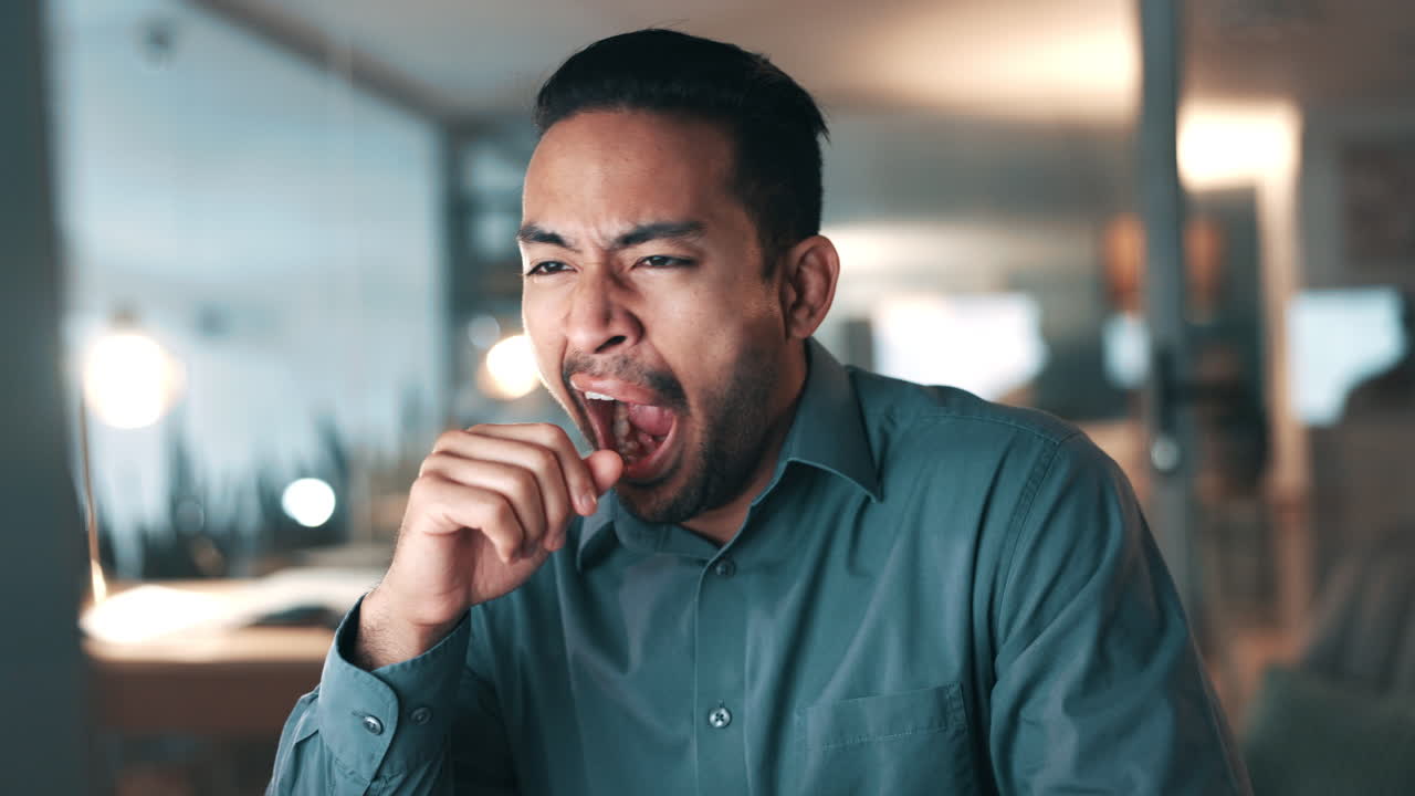 Business man, yawn and tired on computer in night