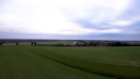 aerial drone footage of a sunset over a norfolk field full of sheep