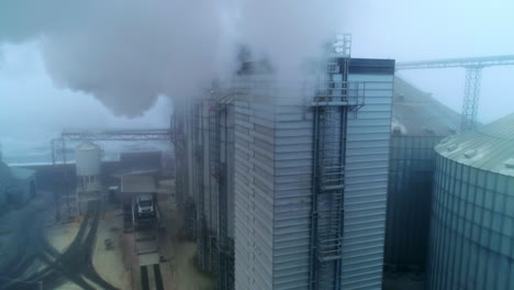 grain elevator and silos in foggy weather