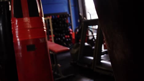 man practicing karate with punching bag