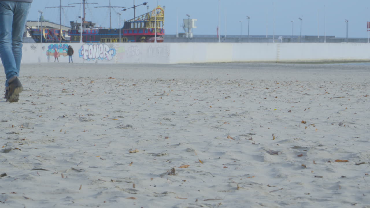 Slow Motion Of People Walking On The Sandy Coast Of Gdynia In Poland. wide