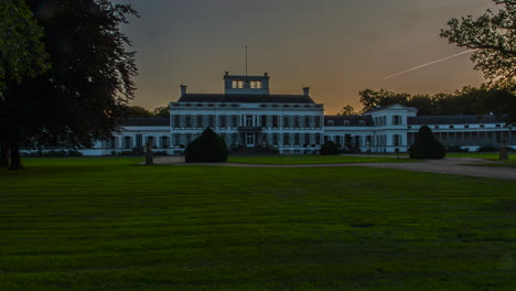 time lapse of a beautiful old palace while the sun is setting - zoom out