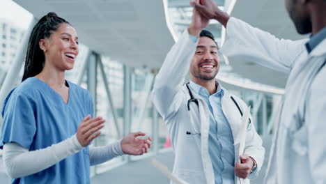 Doctors,-nurses-and-high-five-of-teamwork