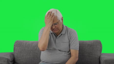 angry indian old man slapping his head green screen