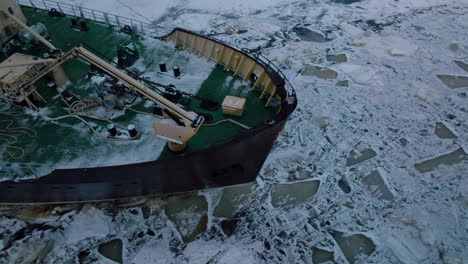 icebreaker ship cruising in the gulf of bothnia with cracked ice during the arctic tour