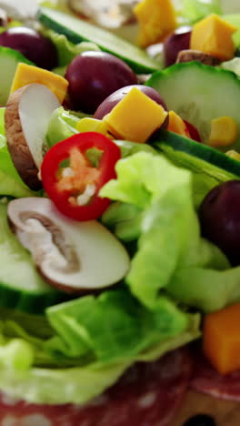 meat and salad on wooden plate