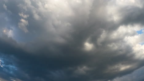 grey rainy clouds spreading by the sky. rain formation in the atmosphere. low angle view timelapse.