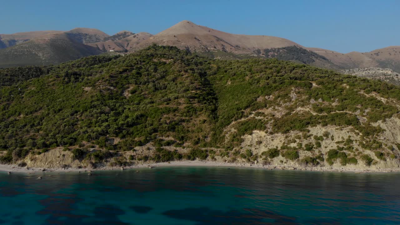 Beautiful coastline in Mediterranean with hills and mountains seen from turquoise sea water in Albania