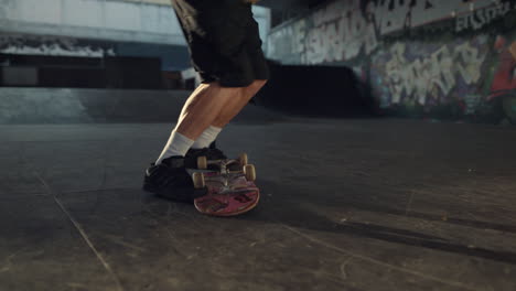 extreme skateboarder jumping skateboard outside. active man falling down.