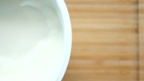 fresh yogurt in a bowl on table