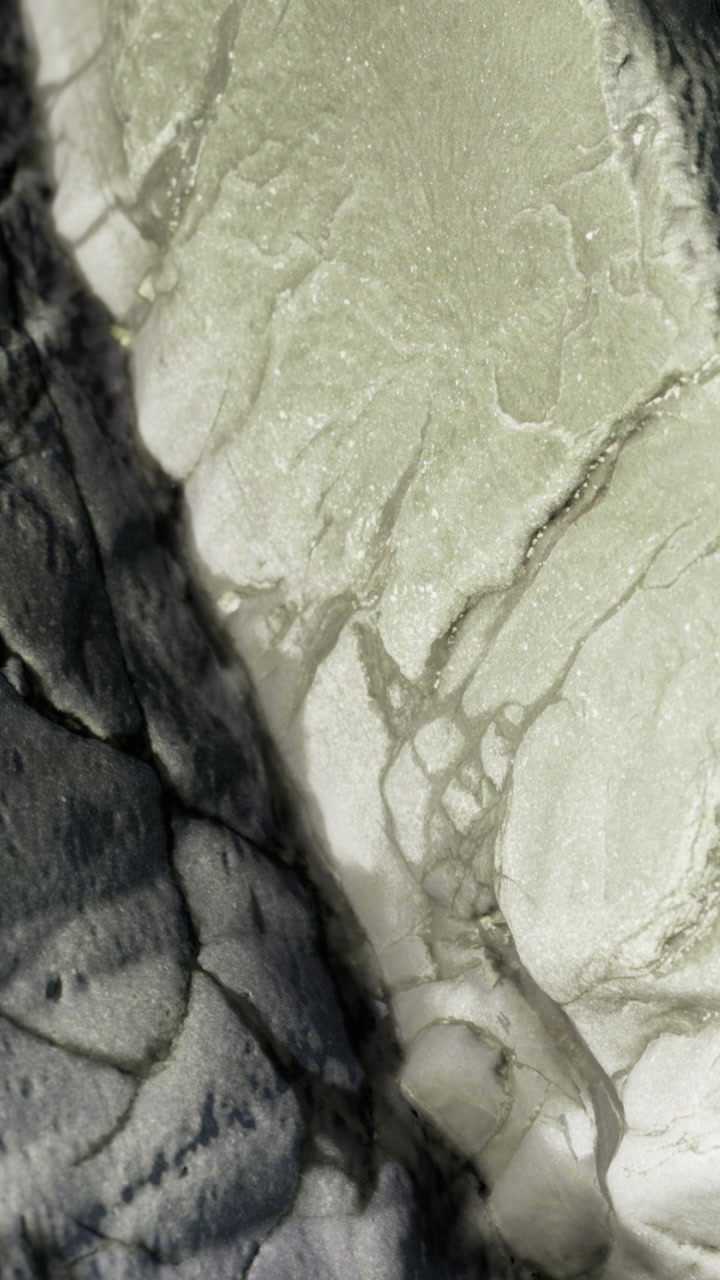 Close view of mineral textures on rock surface in natural setting