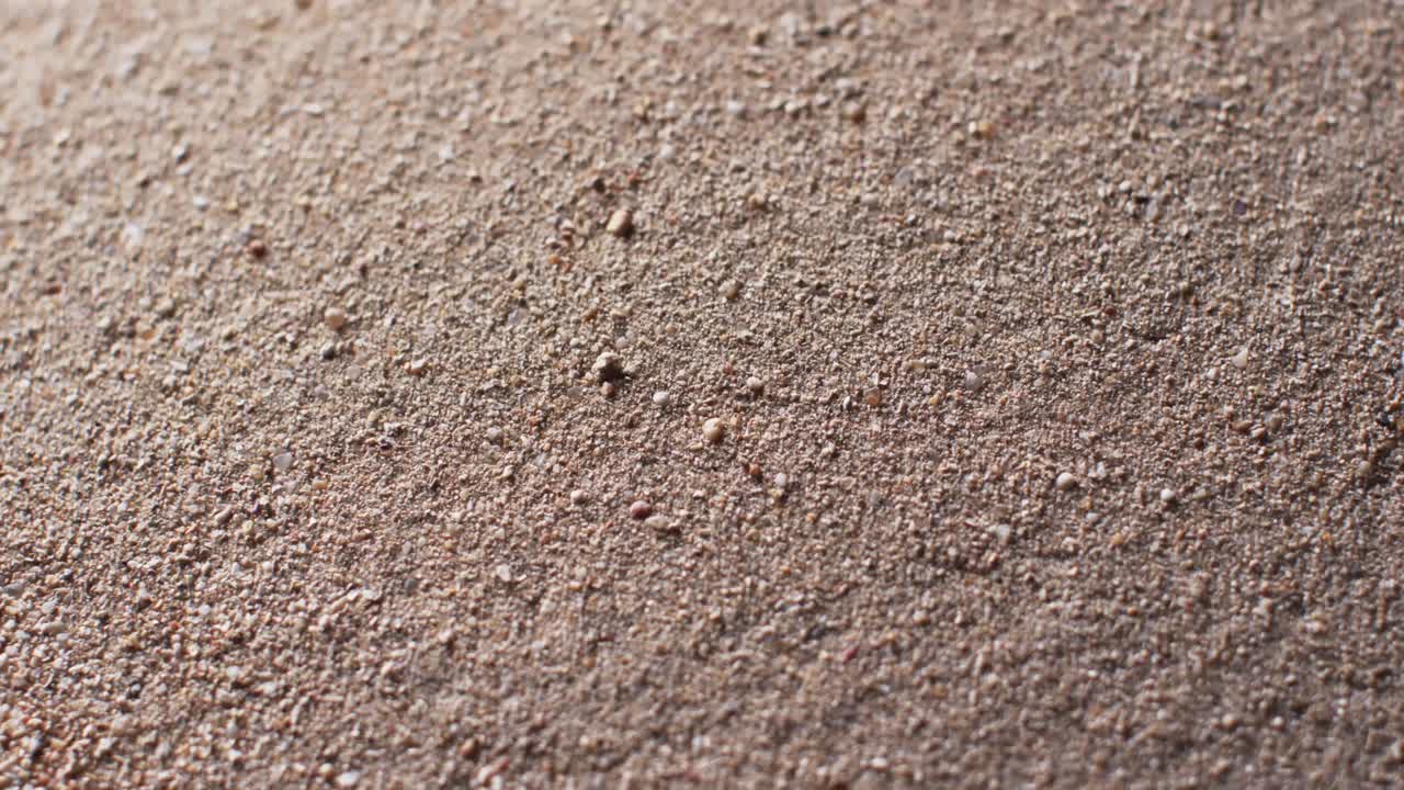 video de un primer plano de los granos de arena con fondo de espacio de copia