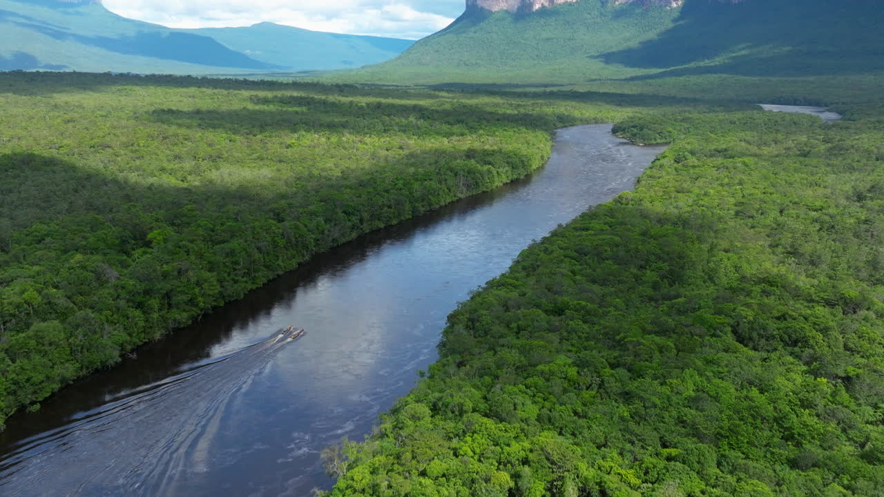 Churun River With Longboats Sailing Through Foliage In Canaima National Park, Venezuela