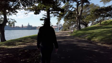 Female-Tourist-Walking-In-The-Botanical-Gardens-In-Sydney,-NSW,-Australia---POV