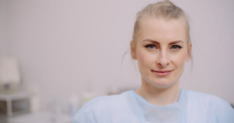 Extreme-Close-Up-Of-Female-Doctor-Smiling-And-Drinking-Glass-Of-Water