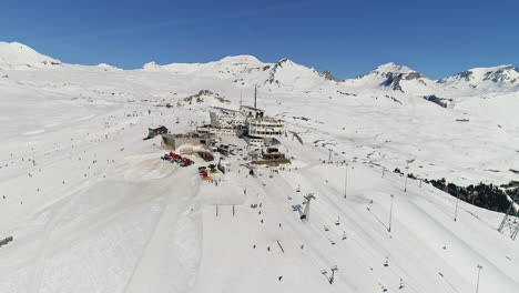 dynamic freestyle skier throwing big airs and stylish tricks on rails at laax snowpark, switzerland—capturing high-level performance, style, and action in a world-class winter setting.