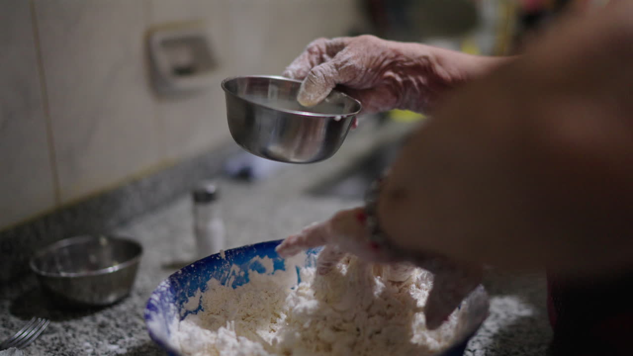 Milk, cassava starch, butter, and cheese mixed together for a delicious Mbeyú dish.