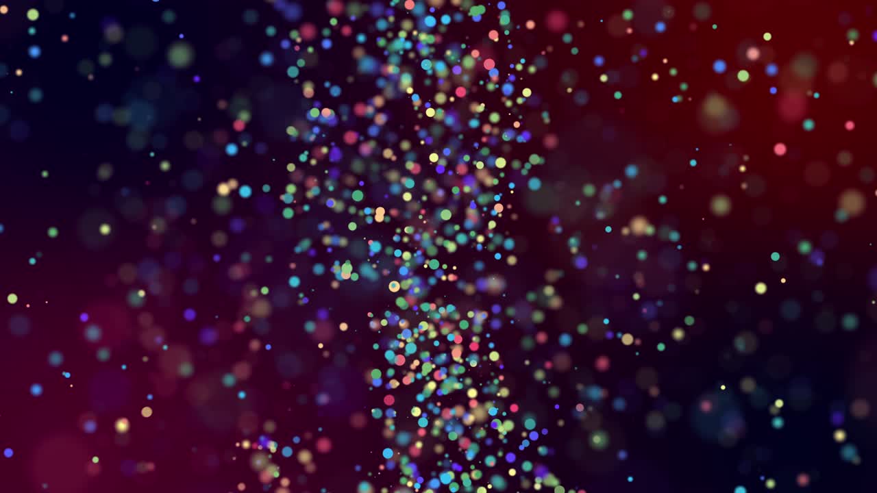 Multicolored confetti float in a viscous liquid.
