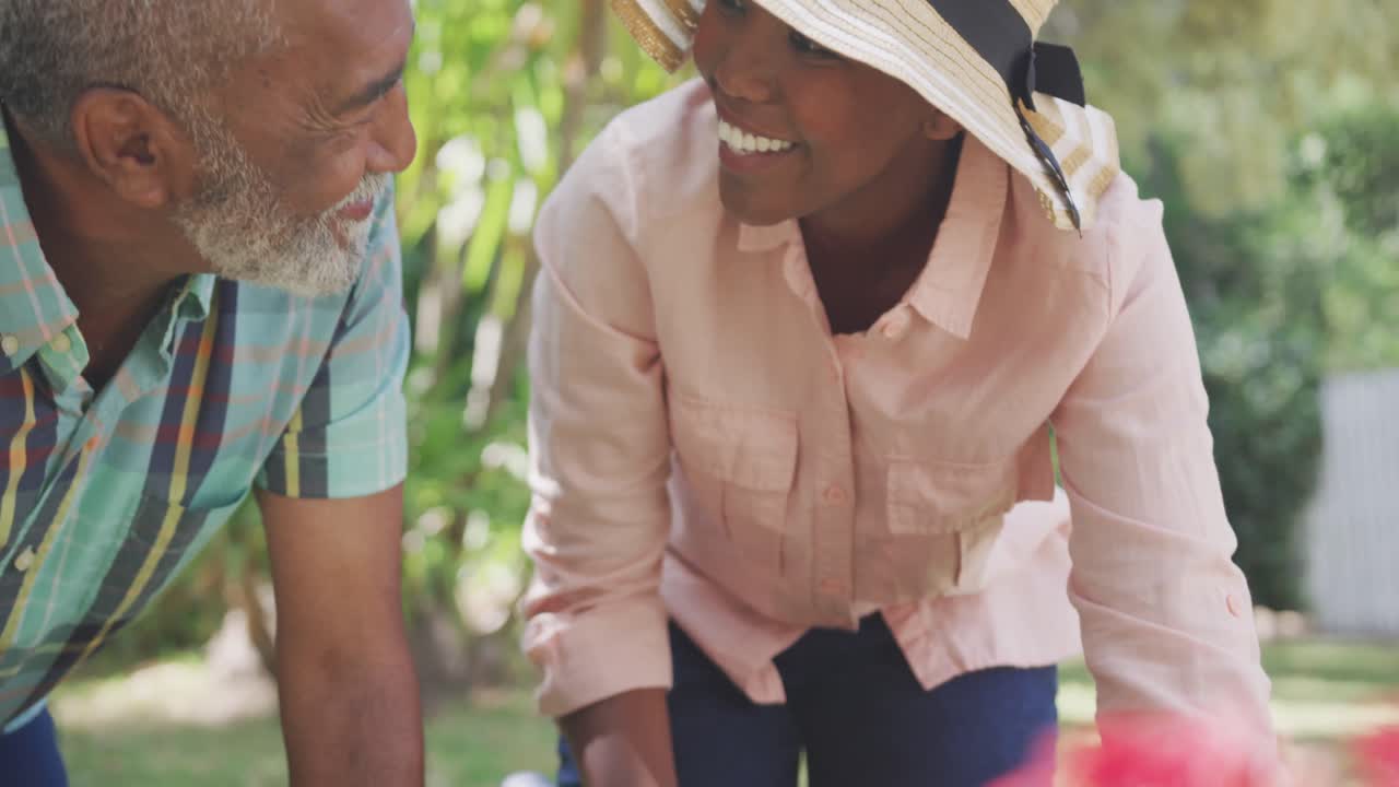padre y hija jardinería durante un día soleado