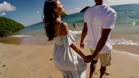 couple walking on a tropical beach