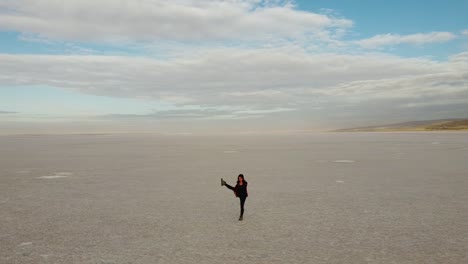 young woman practicing yoga in a beautiful landscape