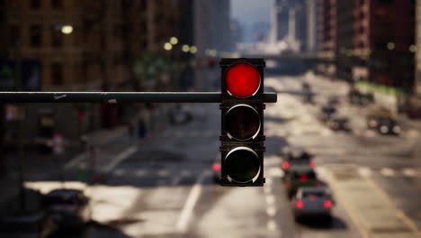 red traffic light in a busy city street