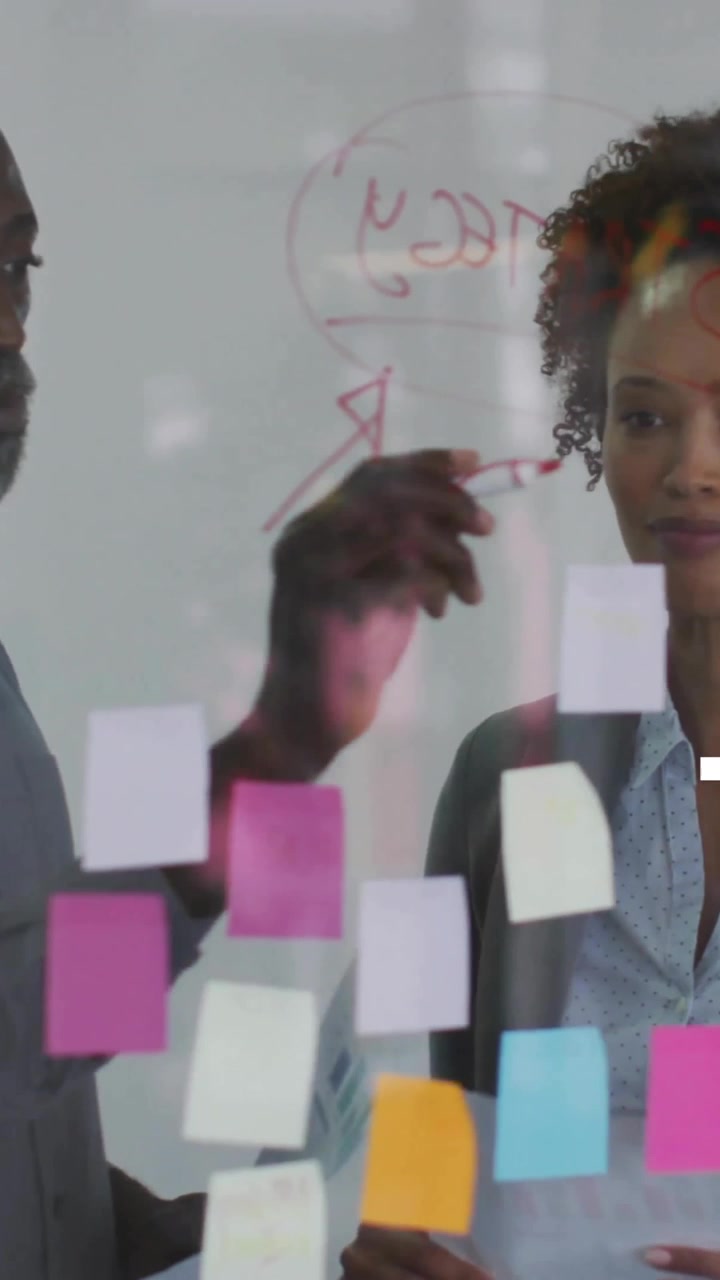 Animation of data processing and diagrams over diverse colleagues discussing work in office