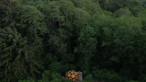 A-drone-tilting-up-from-a-large-tent-to-reveal-a-bay-on-the-Oregon-Coast