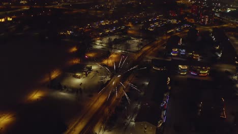 New Year's Eve Celebration With Fireworks Display On Winter Night In Iceland. aerial tilt-down shot