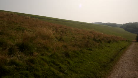 Shot looking up Carsington water dam from the dam trail