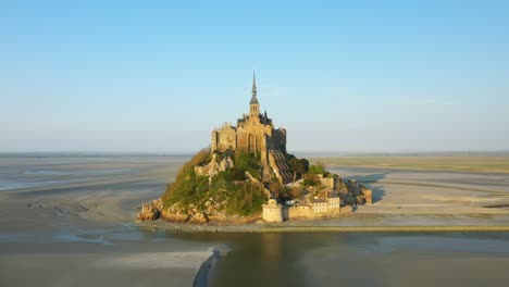 the river borders mont saint michel in europe, france, normandy, manche, in spring, on a sunny day.