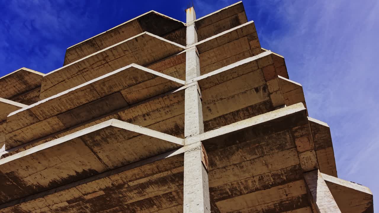 Structural design of concrete building in aerial view under clear sky