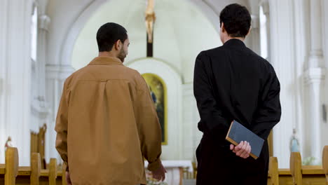 two men talking indoors