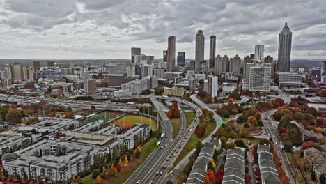 atlanta aerial v755 cinematic pull out shot capturing skyscrapers in central district and low rise buildings in surrounding neighborhoods during autumn season - shot with mavic 3 cine - november 2021