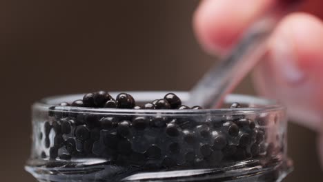 serving caviar with a spoon