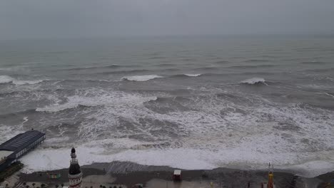 stormy black sea. big waves destroying shore infrastructure and buildings