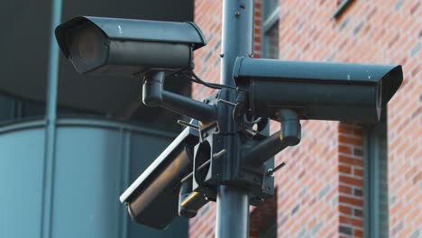 cctv cameras monitor the street of the city and perform the function of an electronic access system by face id.