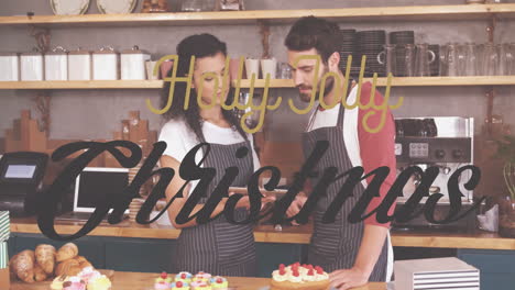 decorating cakes in kitchen, couple adding animation with holly jolly christmas text