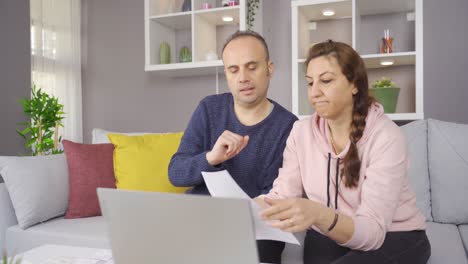 Stressed-Couple-Paying-Their-Bills-Together.