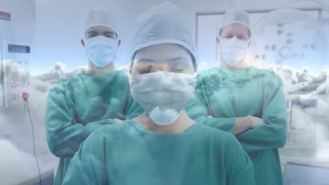 animación de nubes y cielo sobre cirujanos que llevan máscaras faciales en el hospital