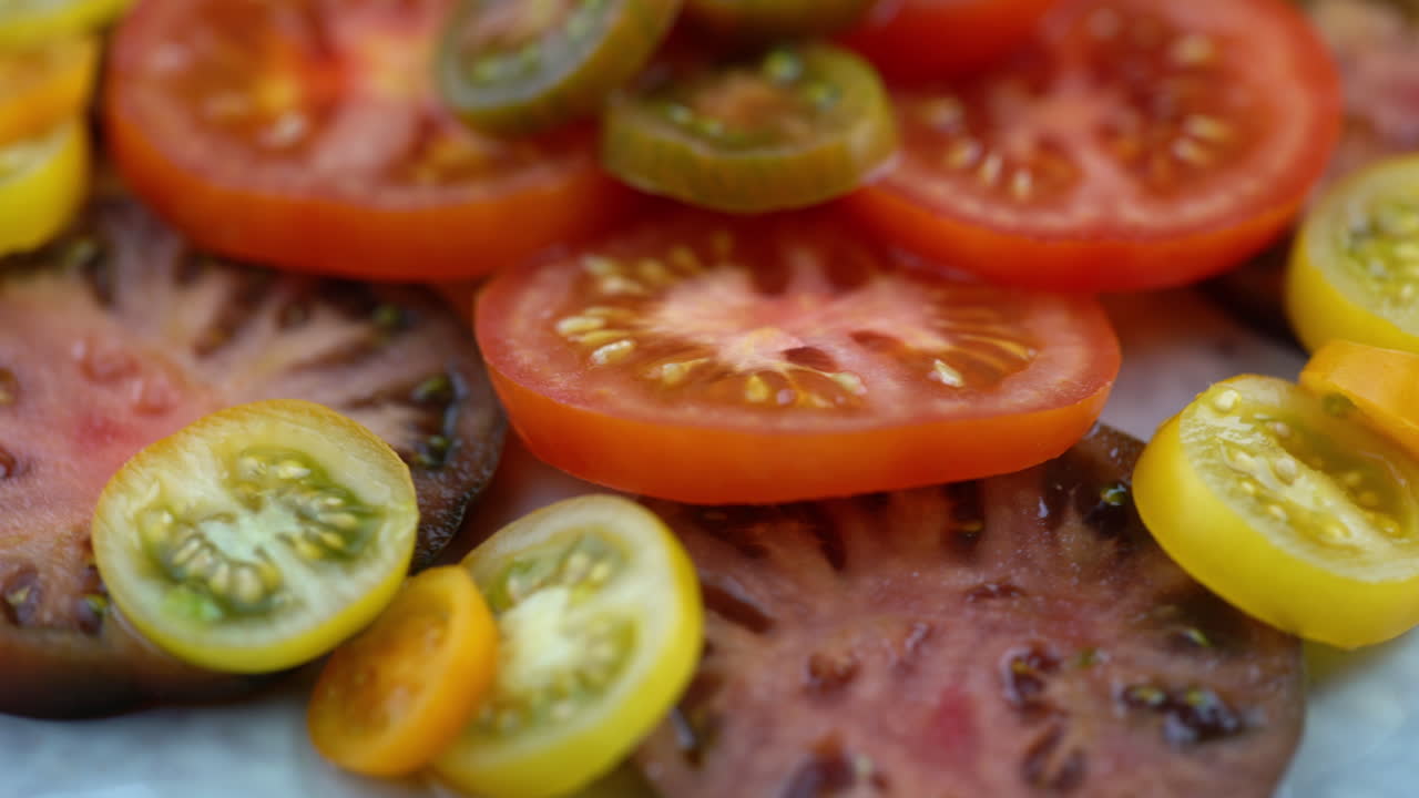 Macro Shot Of Tomatoes On Plate Rotating. Plate Of Healthy Organic Tomatoes, Healthy Vegetarian Vegan Raw Food. Plant Based Raw Food Meal.