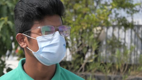 young man wearing mask and glasses