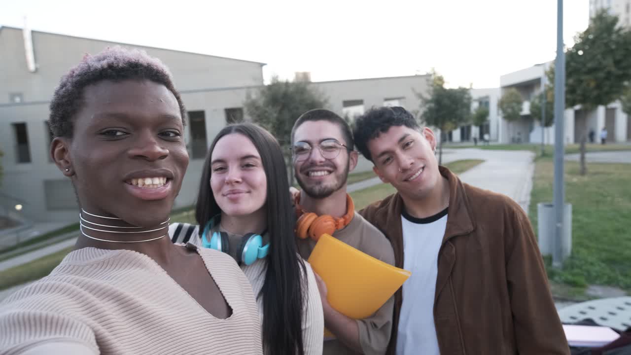 Transgender person taking a selfie with a multiethnic group of friends