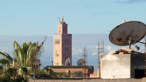 static view from a rooftop of the tower of jemaa el-fnaa mosque with sunset scenic sunlight