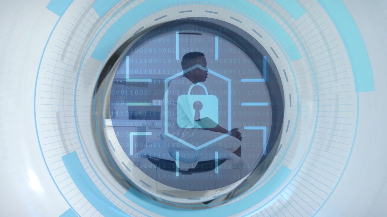 Male patient sitting in scanner bore while medical scan starting, HUD rings and padlock overlaying