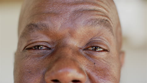 close-up of mature man's eyes and forehead, showing wisdom and experience
