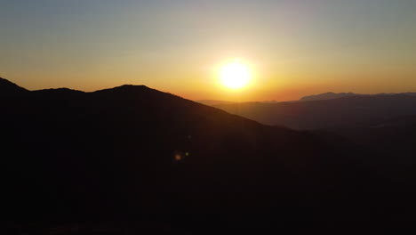 a mountain silhouette at sunset