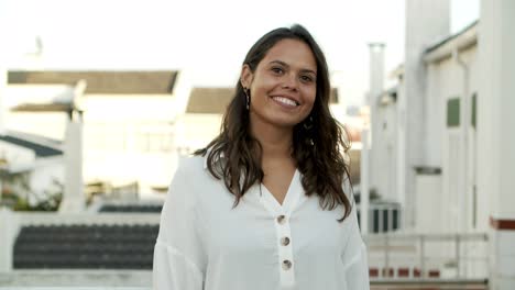 beautiful laughing woman wearing white blouse